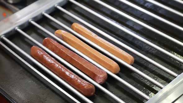 Putting Sausages on the Grill