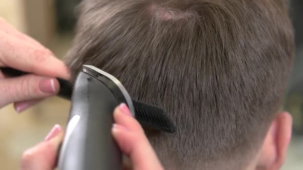 Hands Using Hair Clipper