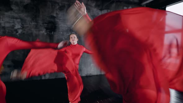 Girl in Red Costumes Doing a Dance Show Indoor