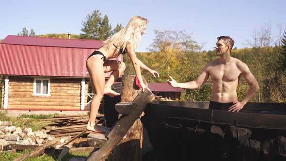 Pleasant Man Calling Girlfriend To Take Bath Outdoors