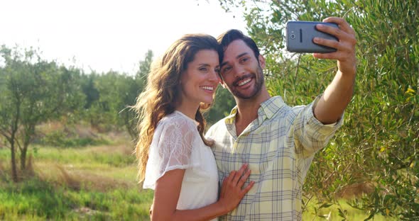 Happy couple taking selfie from mobile 4k