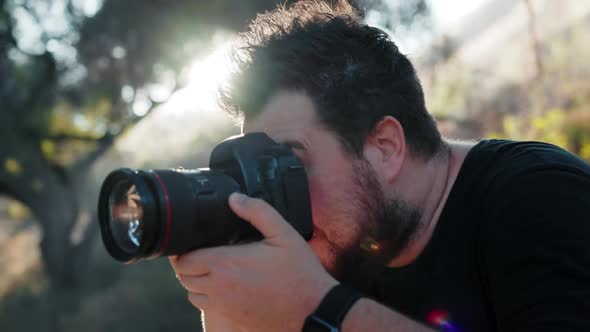 Photographer Excited By Creative Photoshoot Concentrated on Taking Pictures