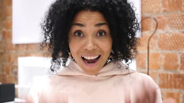 AfroAmerican Woman Inviting Customers with Both Hands