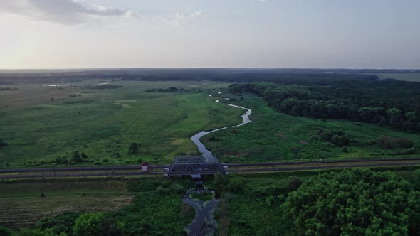 Railway Bridge in Countryside Passing Above Small River