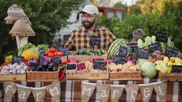 Portrait of Farmer Selling Groceries at Farmers Market Counter