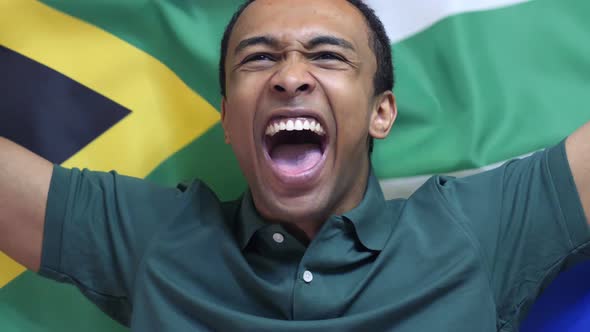 South African Fan celebrates Holding the Flag of South Africa