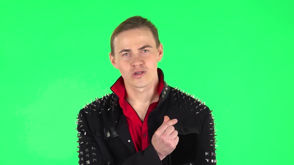 Guy Showing Heart with Fingers Then Blowing Kiss. Green Screen