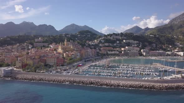 Menton aerial view during day in Cote d'Azur, Provence (France). View over the port and the Saint Mi