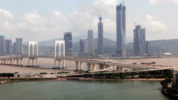 Macau – Zhuhai Border Earial Cityscape Day Timelapse Pan Up