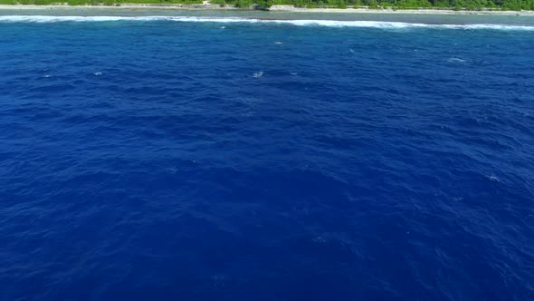 Aerial drone view Pacific Ocean, luxury resort and overwater bungalows, Bora Bora tropical island.