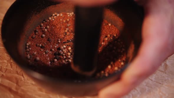 grinding spices in a mortar