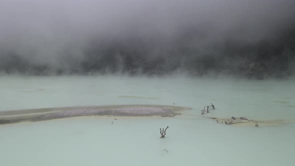 Aerial view fly through smoky in white crater, bandung, Indonesia