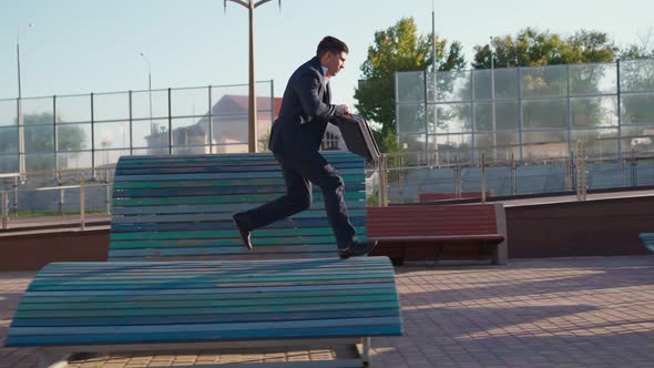 Businessman is Running Fast with Business Briefcase in His Hands Rushing to Work