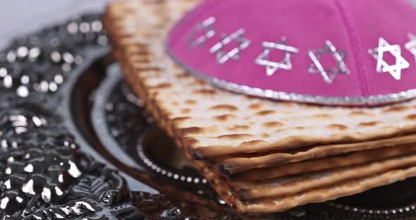 Pesach Israeli matzah bread for Jewish holiday with holy religious book in the torah scroll