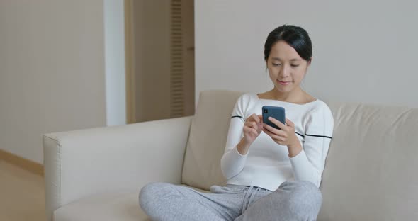Woman use of smart phone at home