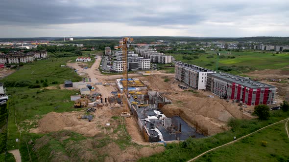 Aerial trucking shot of large construction site built new modern houses and blocks in Poland