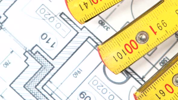 Part of Yellow Folding Rule on Building Plan, Rotation, Close Up