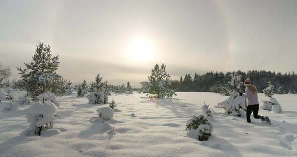 Woman Walking in Deep Snow in Nature on Sunny Winter Day Slow Motion