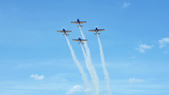 Airplanes Doing Tricks in Blue Sky