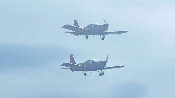 Planes Flying in Parallel on Blue Sunny Sky