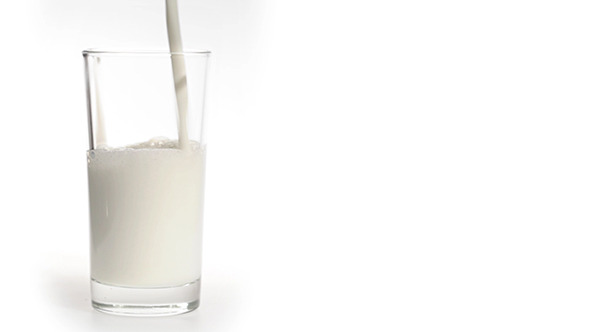 Milk Pouring Into a Glass