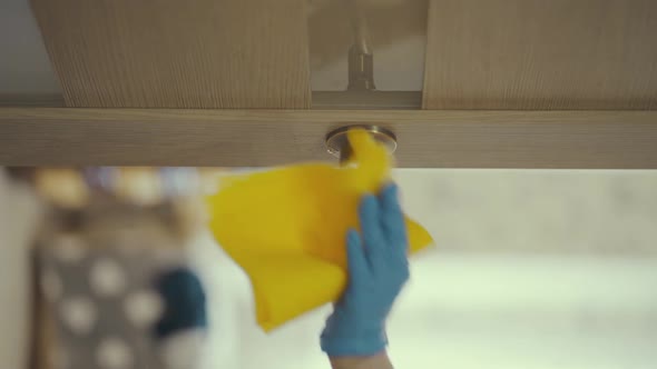 Vertical Video. Closeup of Woman Hands Using a Sanitizer and a Wet Towel for Disinfection Doors Knob