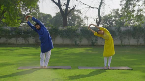 Indian couple doing yoga