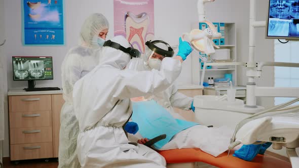 Little Girl Patient Sitting in Dental Chair in New Normal Dentistry Office