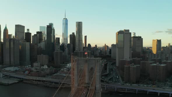 Slide and Pan Footage of Bridge Suspension Tower with American Flag on Top