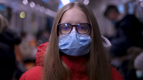 Lovely Teenage Student in Medical Mask in Metro