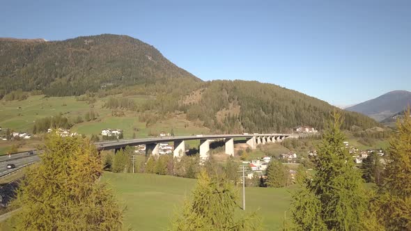 Aerial view of highway interstate road on a bridge with fast moving traffic in rural environment.