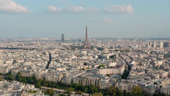 Dolly forward drone shot of the Eiffel Tower Paris at sunset