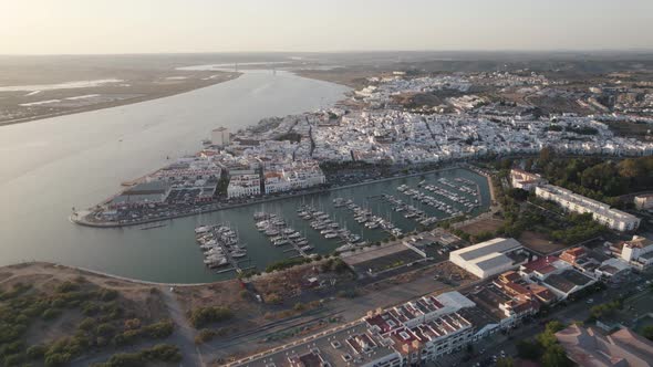 Aerial backwards view of coastal town of Ayamonte with its marina. Andalusia, Spain.