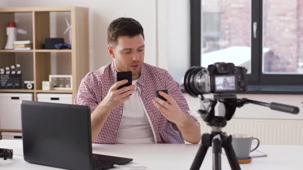 Male Blogger with Gadgets Videoblogging at Home 9