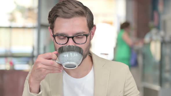 Man Having Toothache After Drinking Coffee