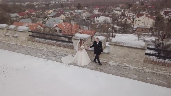 Newlyweds. Caucasian Groom Walking with Bride. Wedding Couple. Aerial View
