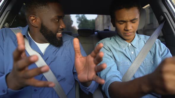 Angry Dad Screaming at Scared Teenage Son Driving Car, Child Upbringing Problem