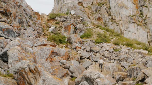 People are climbing in the mountains Summer Baikal lake Olkhon island