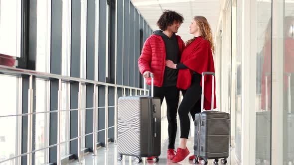 Happy Couple Waiting for Departure at Airport Terminal