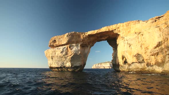 Pan shot view of Azure Window, known as Tieqa Zerqa, a natural rock formation on the coast of Gozo 