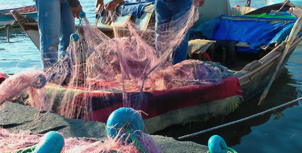 Fishermen Repairs Fishnets