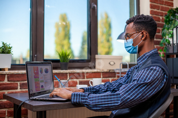 Manager with wireless earbuds in office