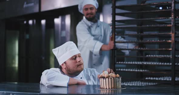 A Hefty Looking Baker Man Wearing a Chefs Attire