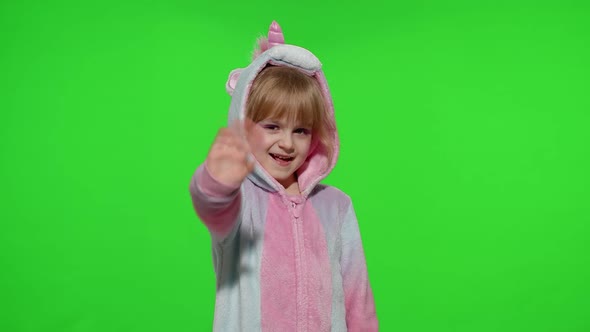 Little Child Girl Smiling Waving Greeting Hello or Bye with Hand in Unicorn Pajamas on Chroma Key