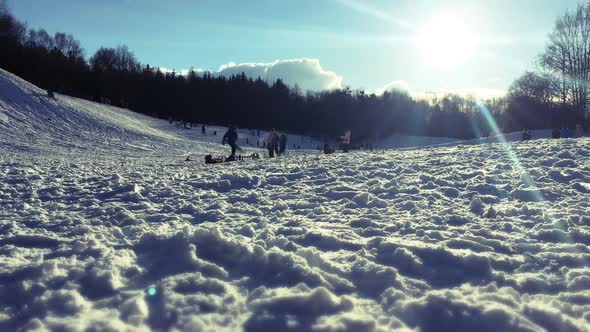 Timelapse Snow sliders - Children playing in the snow