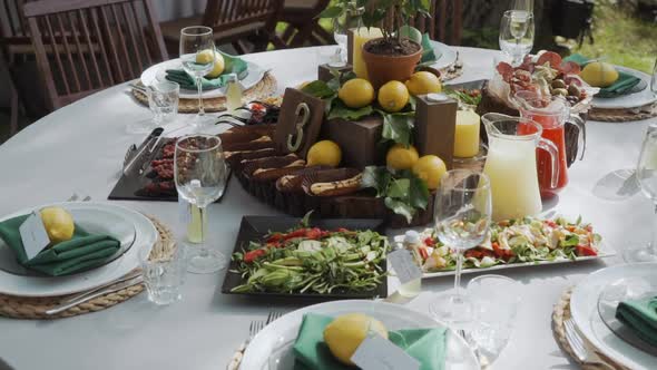 Garden Table Setting with Lemons and Herbs