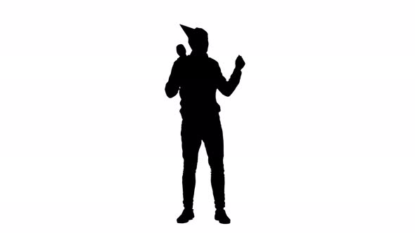 Man in Cap Dances at a Party . White Background. Silhouette