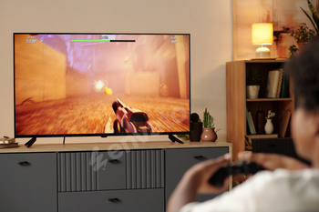 Engaging in Video Game on Large Monitor