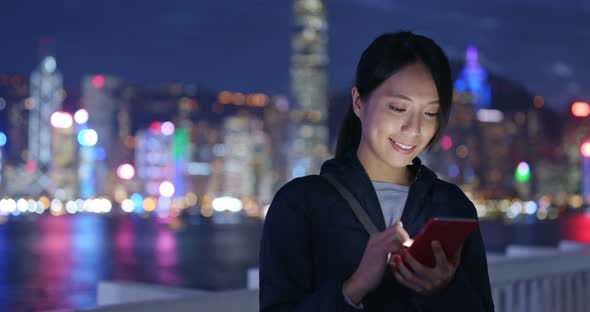 Woman Use of Mobile Phone in City at Night