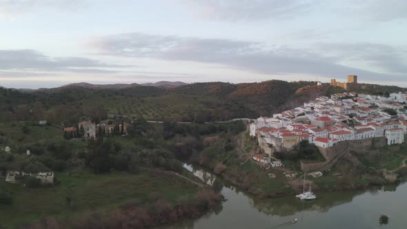 Aerial drone view of Mertola in Alentejo, Portugal at sunset